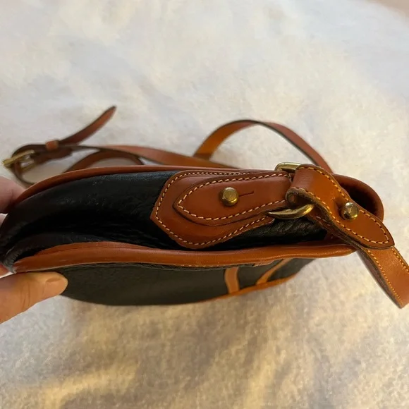 Dooney & Bourke All Weather Leather Black & Tan Saddle Crossbody Bag. - Picture 5 of 9